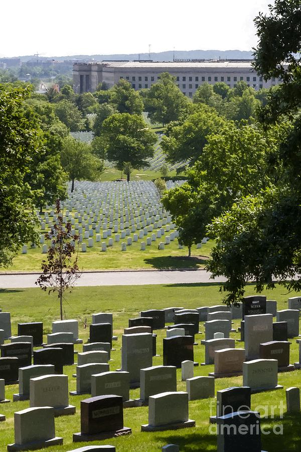 US military graves at Arlington National Cemetery with the Pentagon Building in the background Photograph by William Kuta