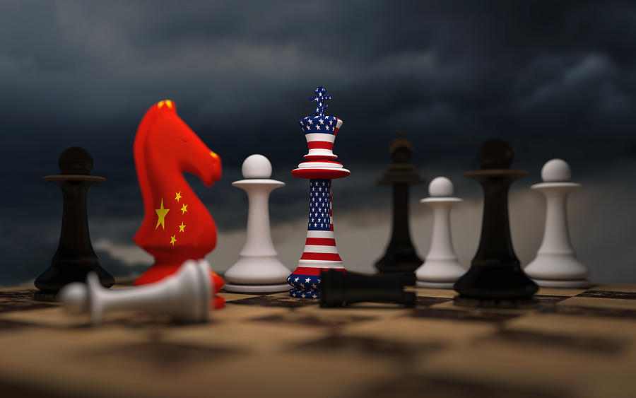 USA and China trade relations, cooperation strategy. US America and China flags on chess king on a chessboard. Photograph by Zhangshuang