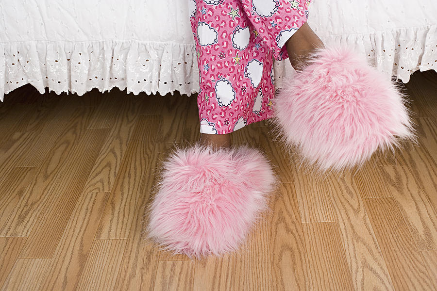 USA, California, Los Angeles, Close up of girls (10-11) legs in pajamas and slippers Photograph by Rob Lewine