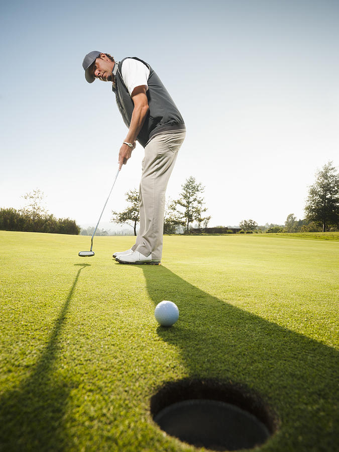 USA, California, Mission Viejo, Man playing golf Photograph by Erik Isakson