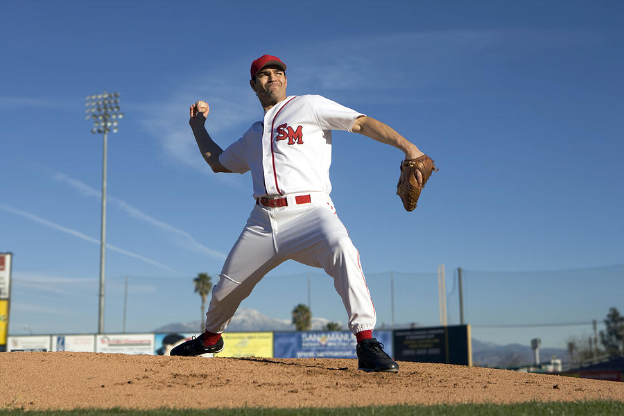USA, California, San Bernardino, baseball pitcher throwing pitch, outdoors Photograph by Donald Miralle