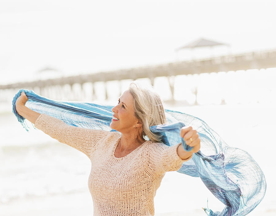 USA, Florida, Jupiter, Senior woman on beach Photograph by Daniel Grill