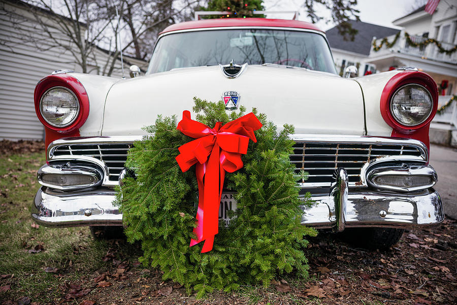 USA, Maine, Kennebunkport, antique Ford car with Christmas wreath Photograph by Panoramic Images