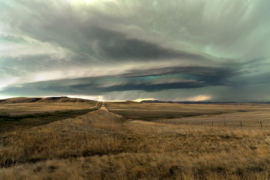 USA, Montana, Storm clouds above field Photograph by Peterspencer