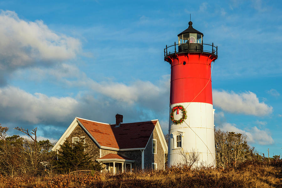 USA, New England, Massachusetts, Cape Cod, Eastham, Nauset Light lighthouse with Christmas wreath Photograph by Panoramic Images
