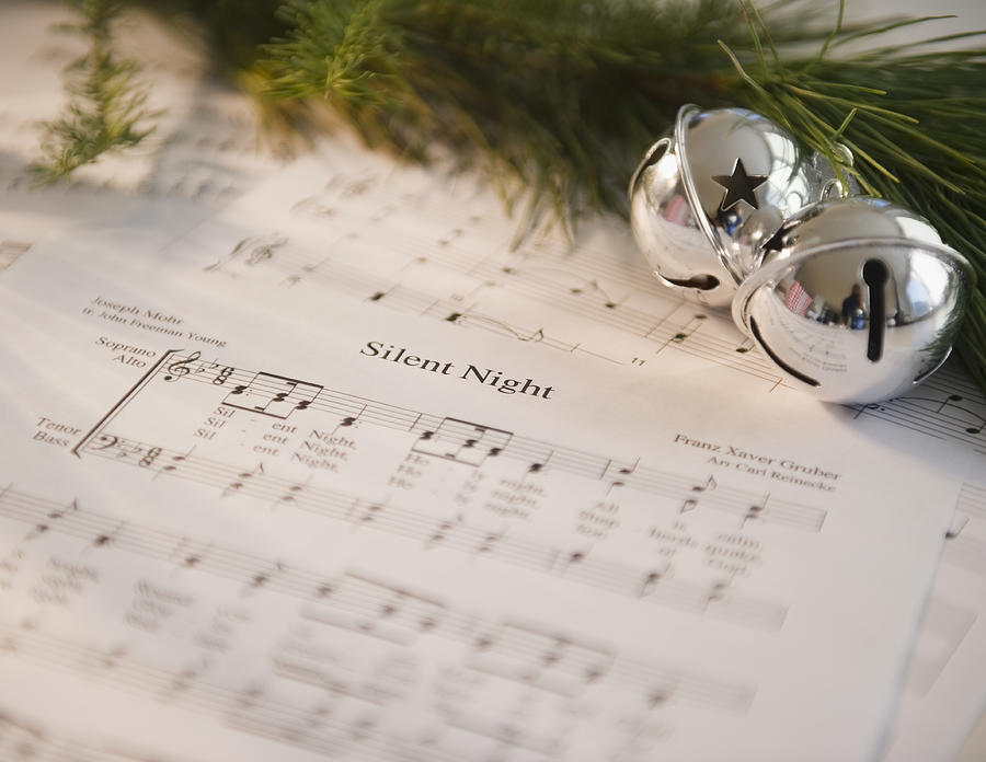 USA, New Jersey, Jersey City, Christmas baubles on carol music sheet Photograph by Jamie Grill Photography