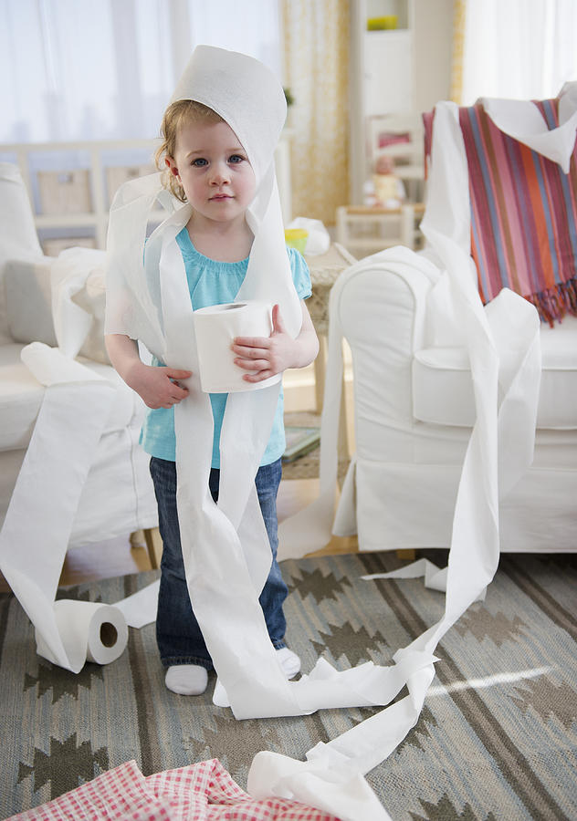 USA, New Jersey, Jersey City, Girl (2-3) wrapped with toilet paper standing in living room Photograph by Jamie Grill
