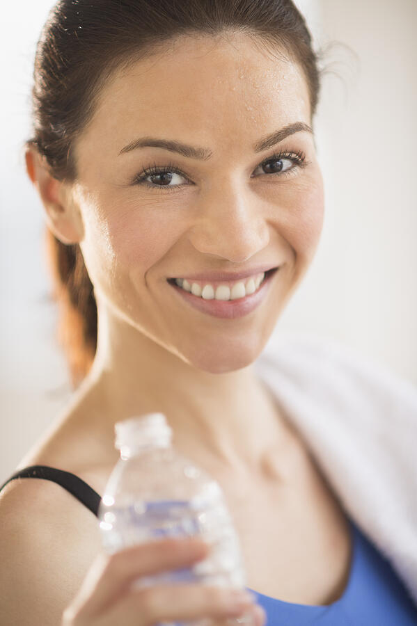 USA, New Jersey, Jersey City, Portrait of woman drinking water in gym Photograph by Tetra Images