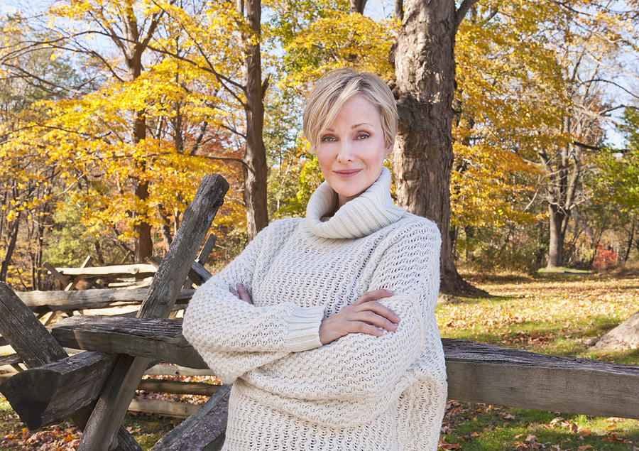 USA, New Jersey, Portrait of smiling woman in Autumn forest Photograph by Tetra Images