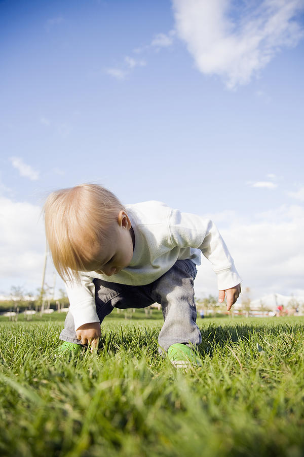 USA, New York City, baby boy (0-1 years) on grass Photograph by Maisie Paterson