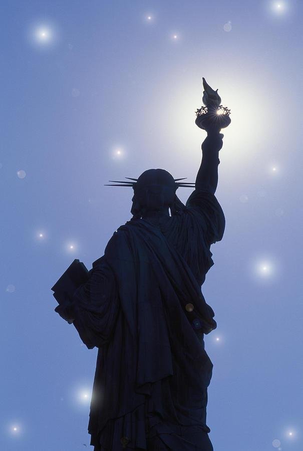 USA, New York, New York City, Statue of Liberty against starry sky, rear view Photograph by Grant Faint