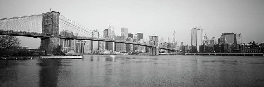 USA, New York State, New York City, Brooklyn Bridge, Skyscrapers in a city Photograph by Panoramic Images