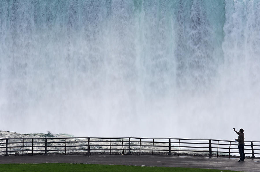USA, New York State, Ontario, Niagara Falls, man photographing waterfall Photograph by Martin Ruegner