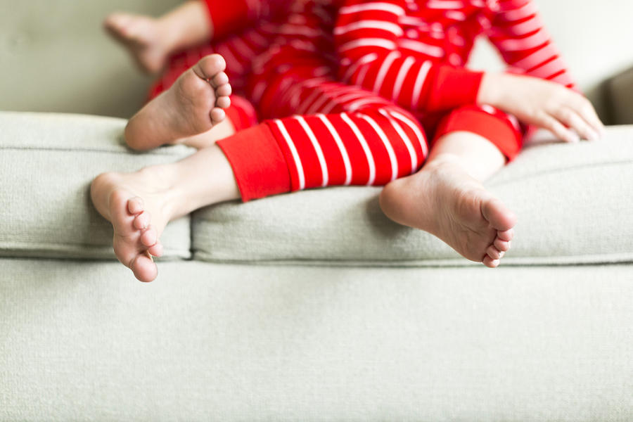 USA, Utah, Salt Lake City, Feet of siblings (2-3, 4-5) in red pajamas Photograph by Jessica Peterson