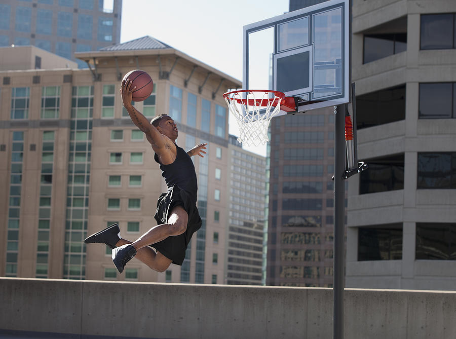 USA, Utah, Salt Lake City, man playing basketball Photograph by Mike Kemp