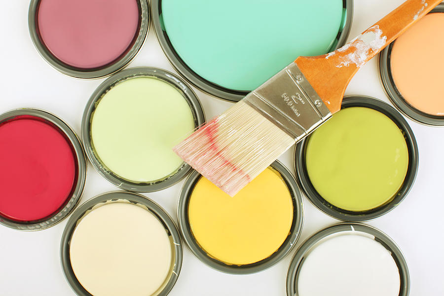 Used paintbrush on top of paint can lids Photograph by GeorgePeters