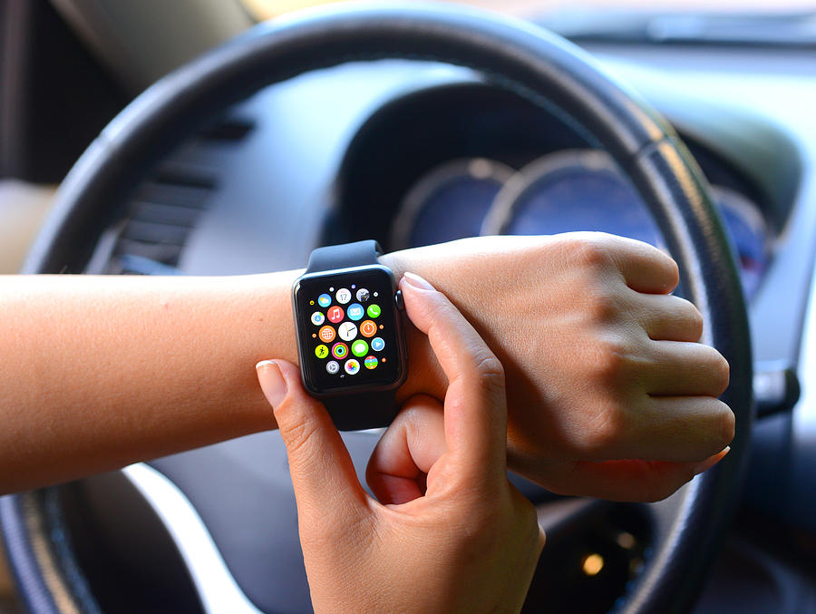 Using new black Apple Watch Sport in car Photograph by Hocus-focus