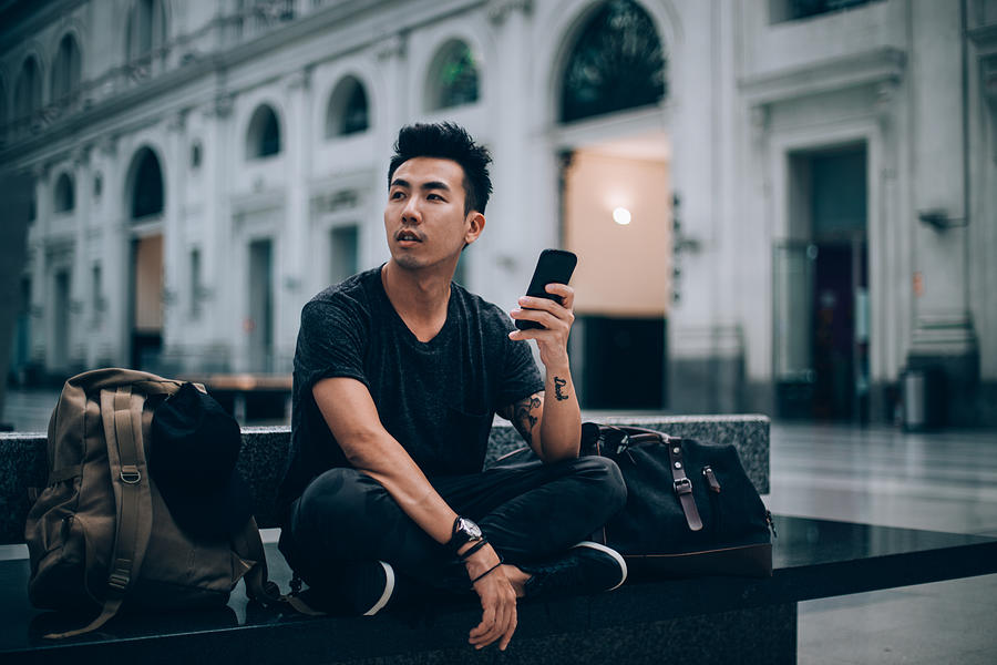 Using smart phone while waiting for my train Photograph by South_agency