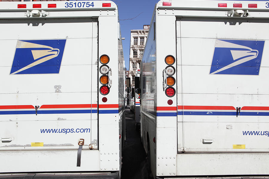 USPS mail delivery trucks NYC Photograph by CribbVisuals