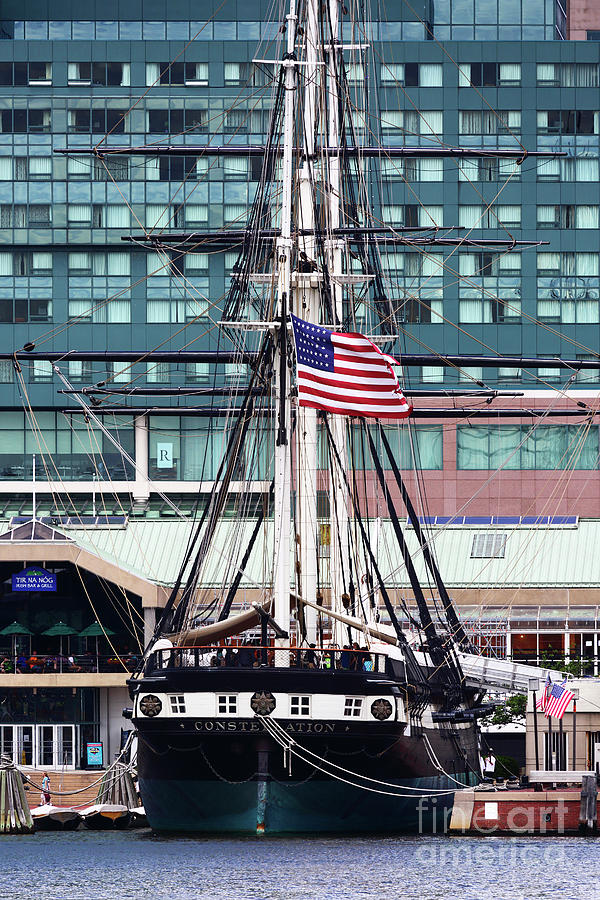 USS Constellation and The Gallery at Harborplace building Baltimore Photograph by James Brunker