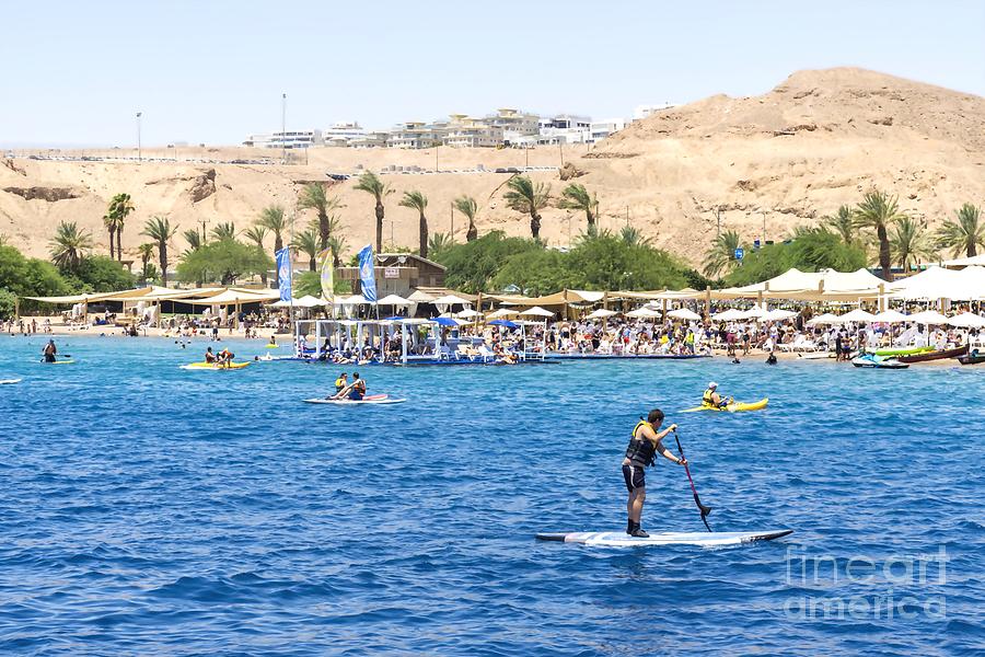 Vacationers enjoy Dekels Beach on the Gulf of Aqaba in Eilat, Israel. Photograph by William Kuta