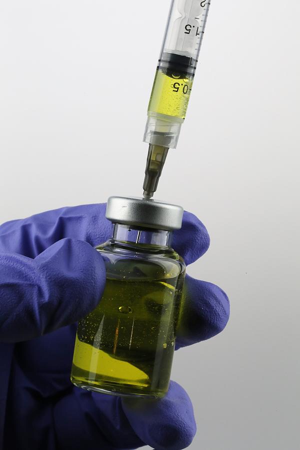 Vaccine being prepared for immunization of a patient Photograph by Douglas Sacha