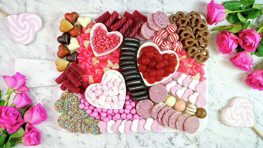 Valentines Day flat lay overhead candy and cookies grazing platter. Photograph by Milleflore Images