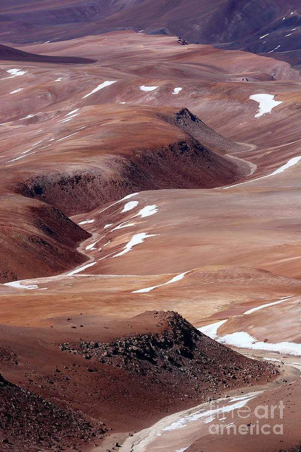 Valleys and rock outcrops in the Puna de Atacama deserts Chile Photograph by James Brunker