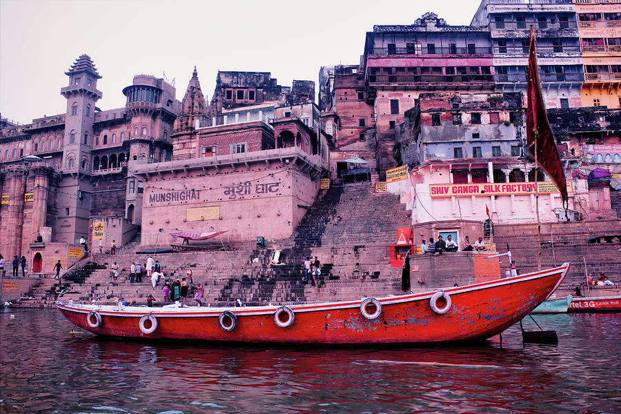 Varanasi, India  A wooden Boats at river Ganga docked against old architecture of mushi ghat in the holy city located in the state of Uttar pradesh. Photograph by Arpan Bhatia