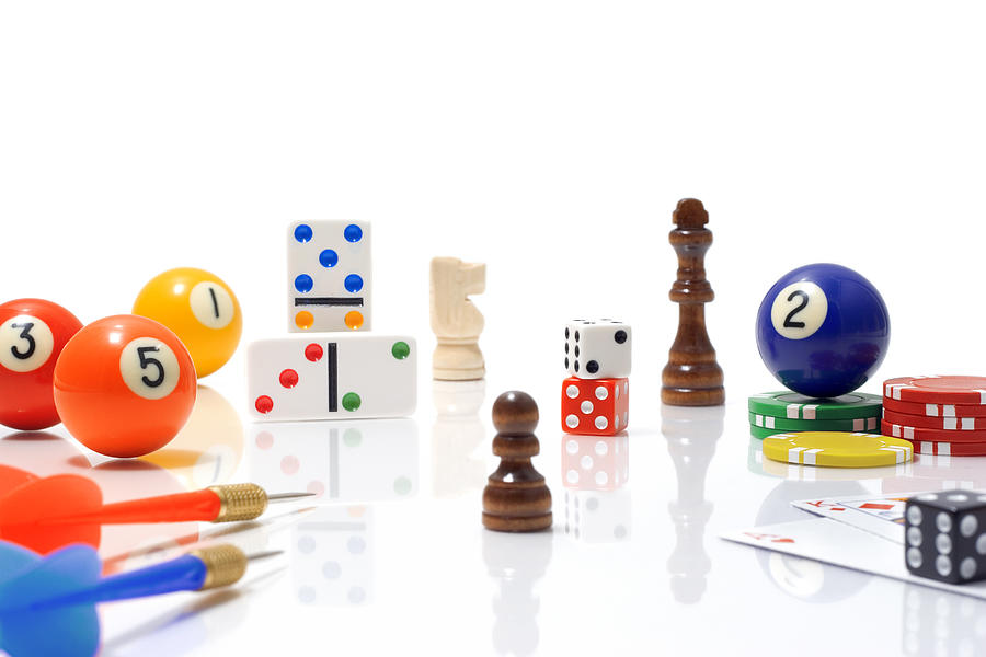 Variety of Game Pieces on White Background Photograph by Elerium
