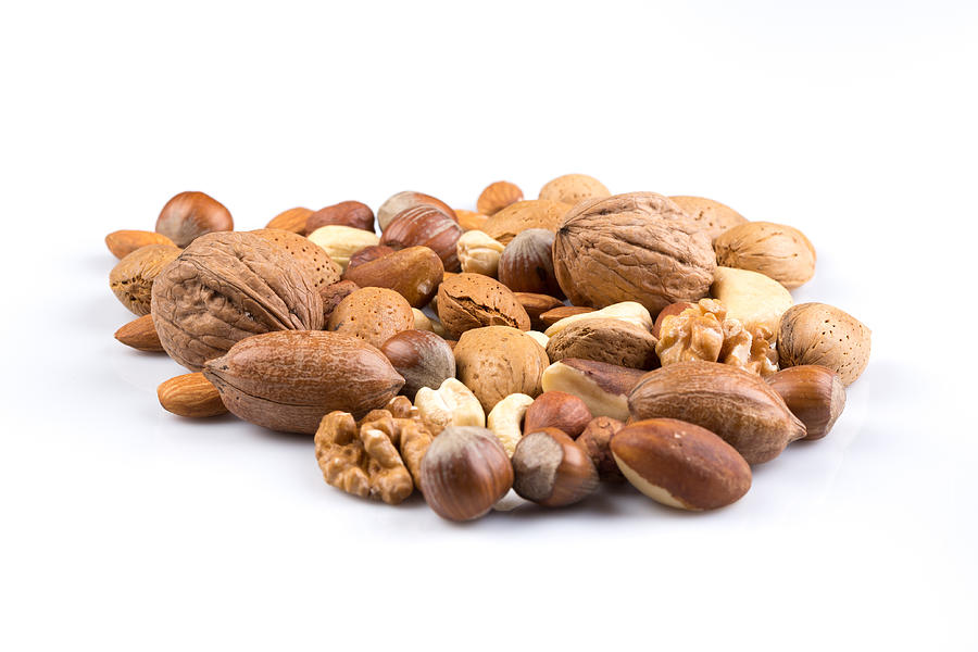Variety of Mixed Nuts Isolated on White Background Photograph by R.Tsubin