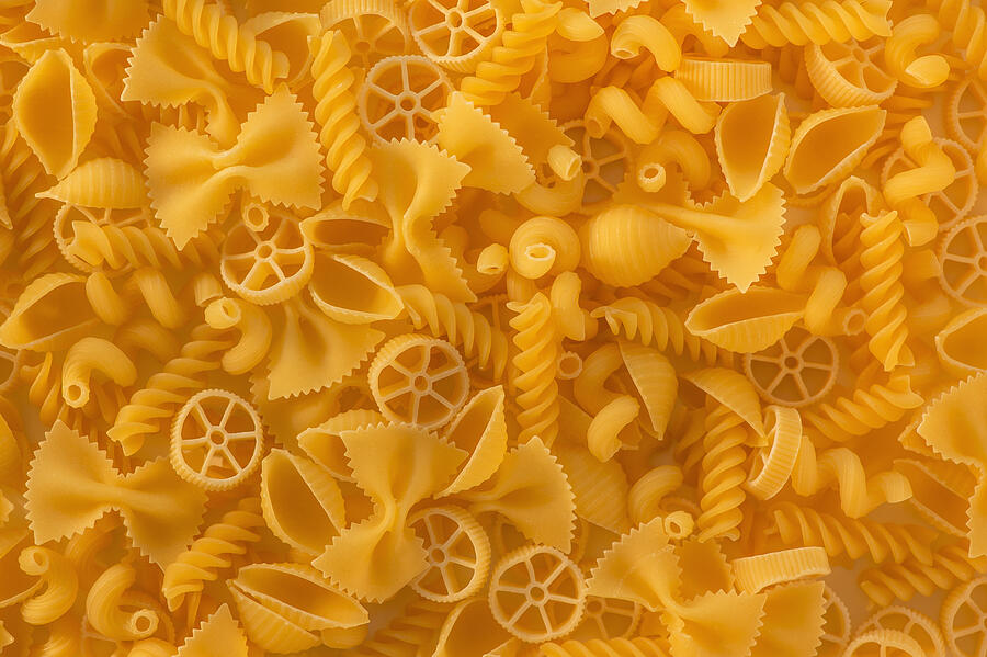 Variety of yellow pasta Photograph by Daniel Grill