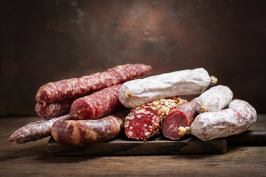 Various kind types of salami and sausages Photograph by Nitrub
