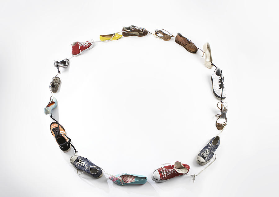 various shoes tide together in a Circle Photograph by Rebecca Van Ommen