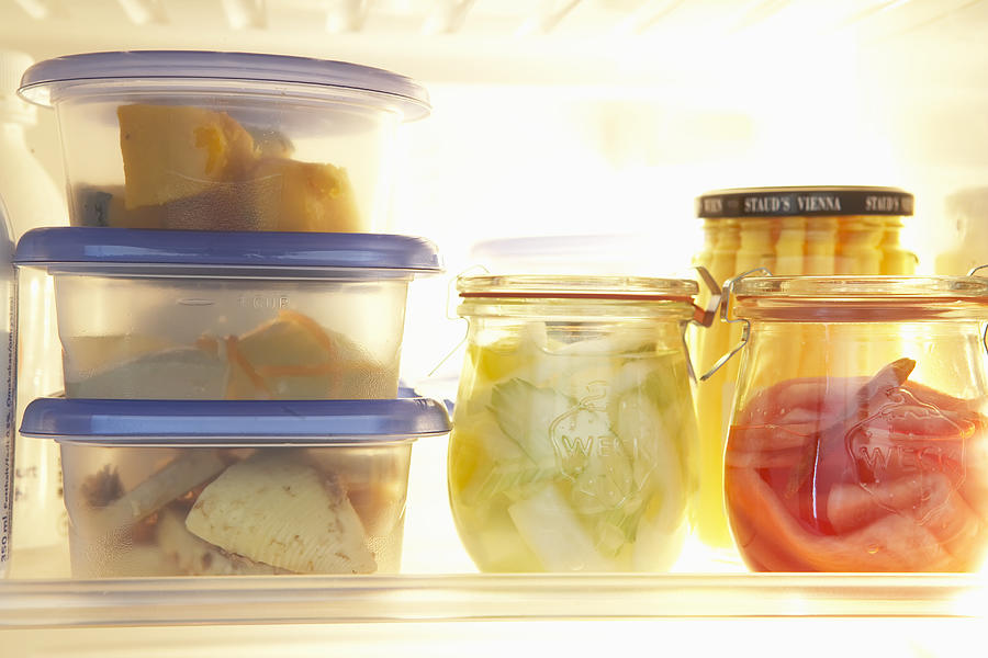 Various types of food in plastic container pots in refrigerator Photograph by Ichiro