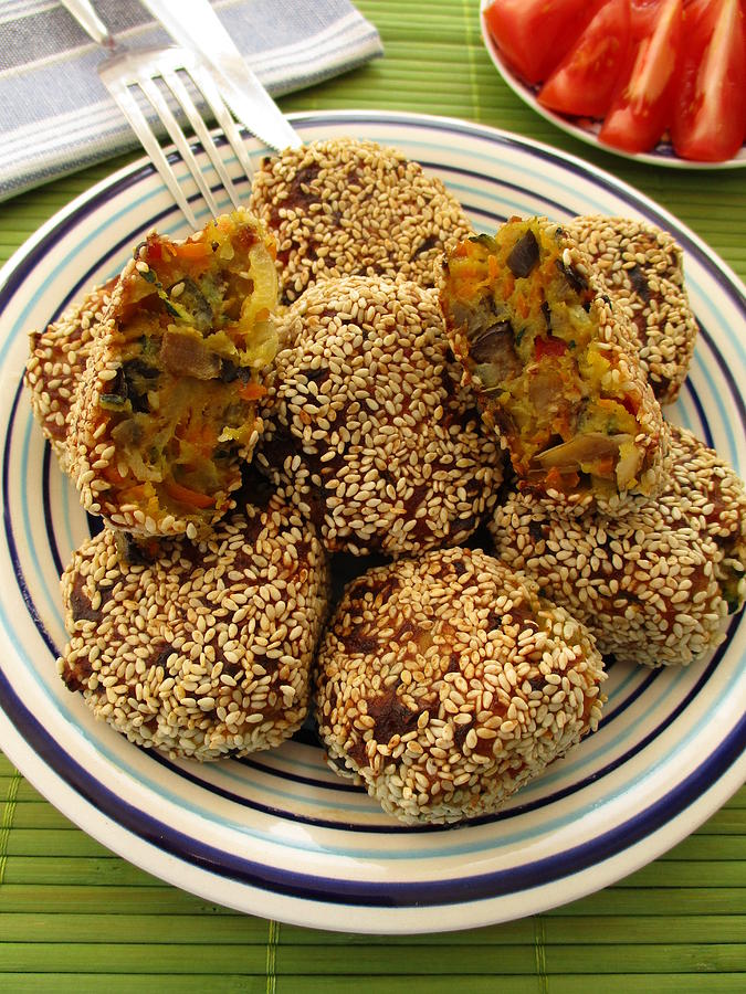 Vegetable fritters with sesame seeds Photograph by Tanai