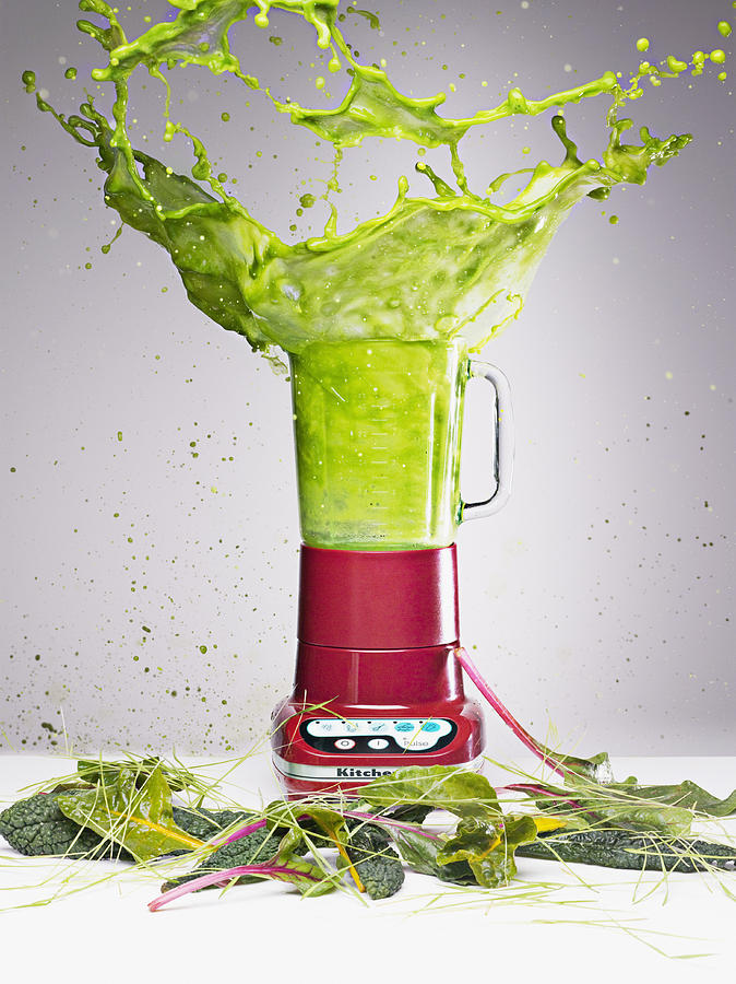 Vegetable juice splashing from blender Photograph by Robert Daly