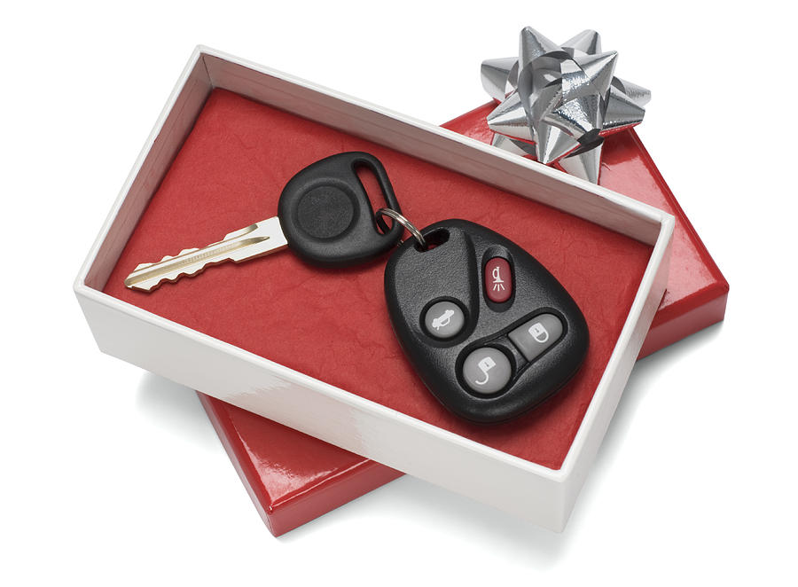 Vehicle keys in white and red gift box with silver bow Photograph by GodfriedEdelman