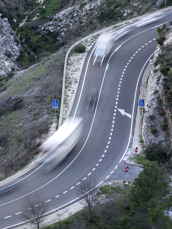 Vehicles in movement in a road with curves Photograph by Jose A. Bernat Bacete