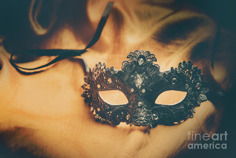 Venetian mask on yellow silk. Photograph by Jelena Jovanovic