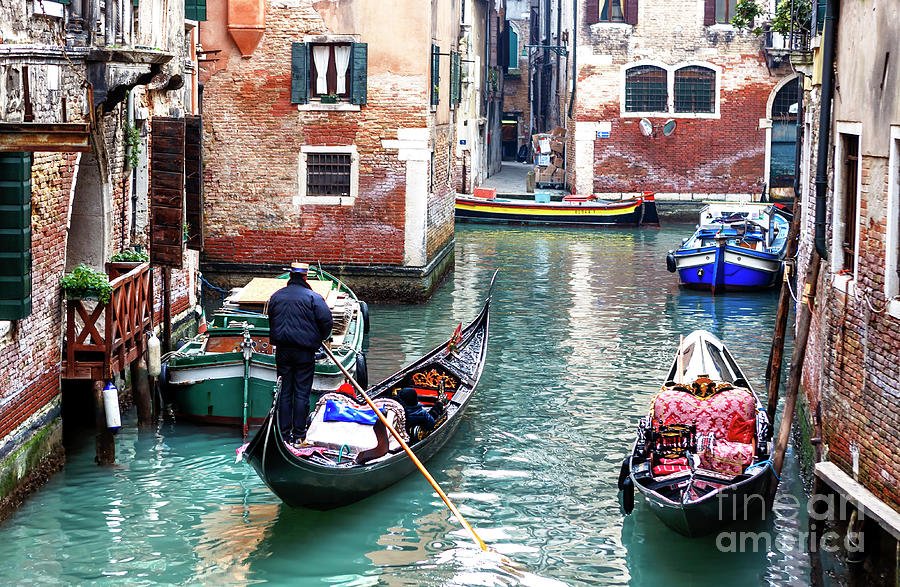 Venice Canal Transportation in Italy Photograph by John Rizzuto