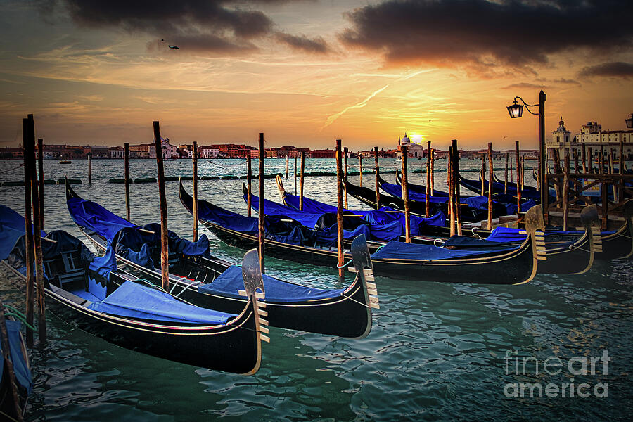 Venice, gondolas or gondole on sunset and church on background. Photograph by Stuart Chard Venice, gondolas or gondole on sunset and church on background. Photograph by Stuart Chard