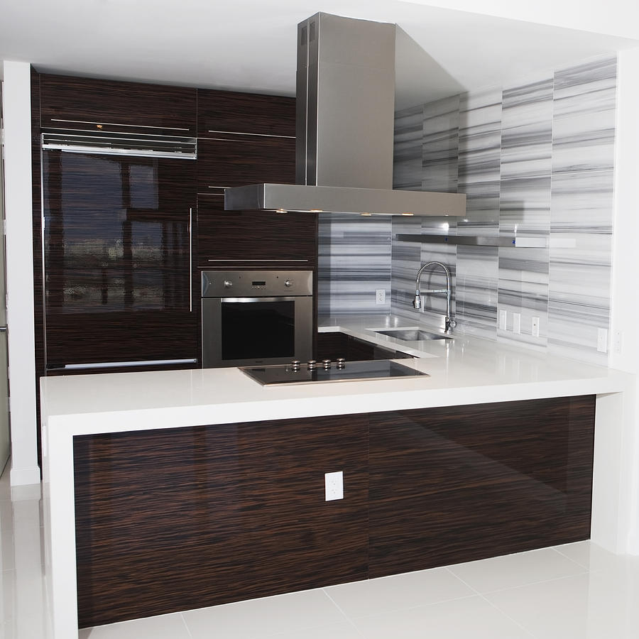Vent, stove and countertop in empty modern kitchen Photograph by Camilo Morales
