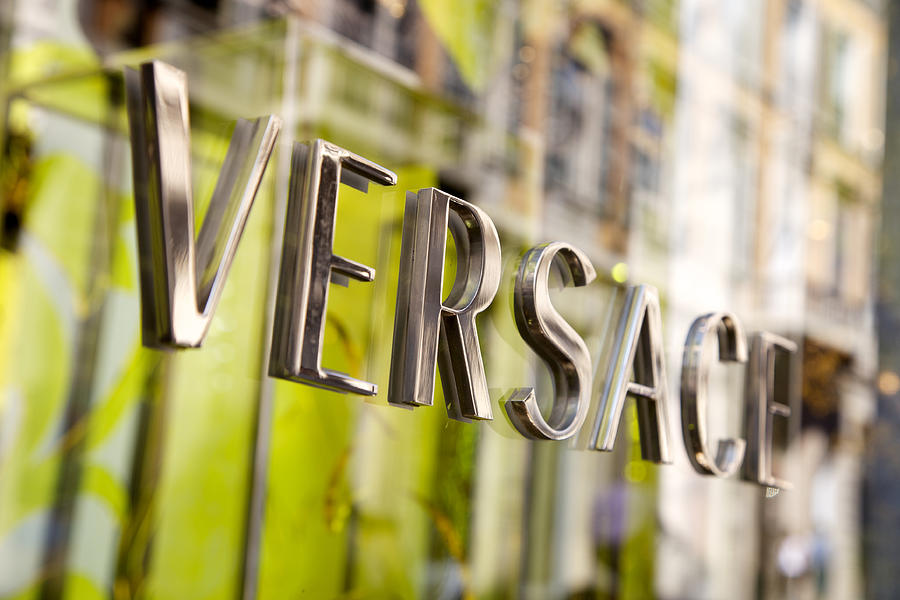 Versace Store Sign In Milan Photograph by Massimo Merlini
