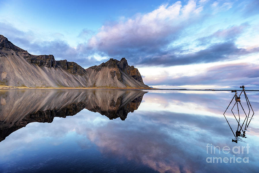 Vestrahorn reflected in shallow waters, Southern Iceland. Two tripods are set to take photographs. Photograph by Jane Rix