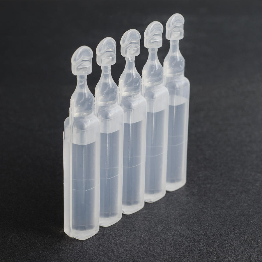 Vials containing physiological serum Photograph by Opreaistock