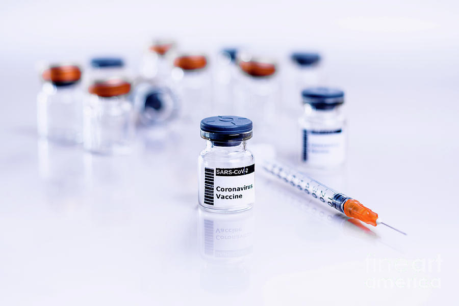 Vials of the coronavirus COVID-19 vaccine are administered thr Photograph by Joaquin Corbalan