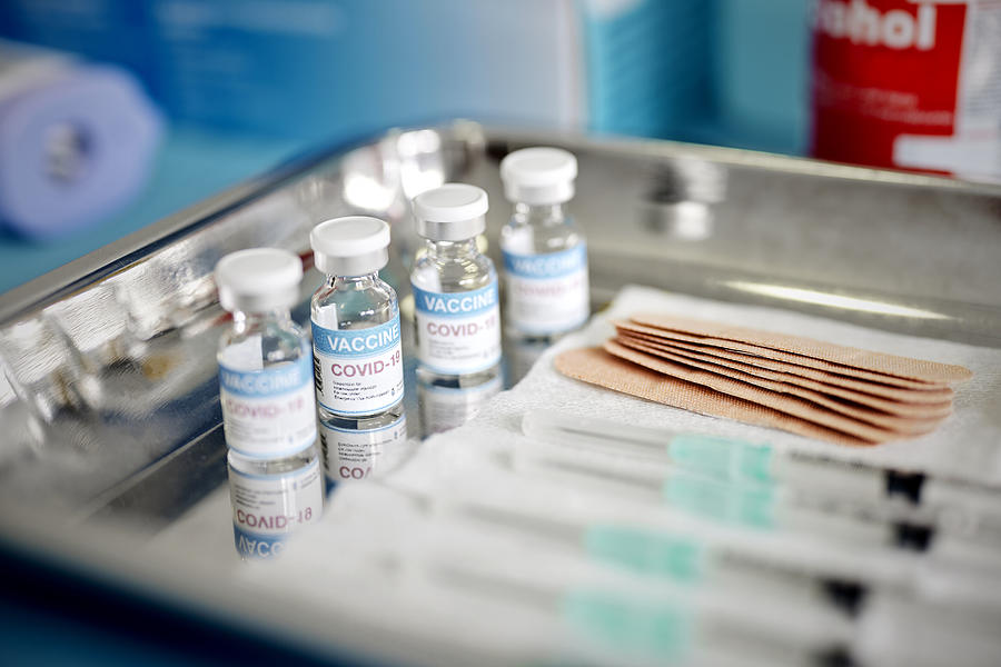 Vials With the Covid-19 Vaccine and Syringes are Displayed On a Tray at the Corona Vaccination Center Photograph by Morsa Images