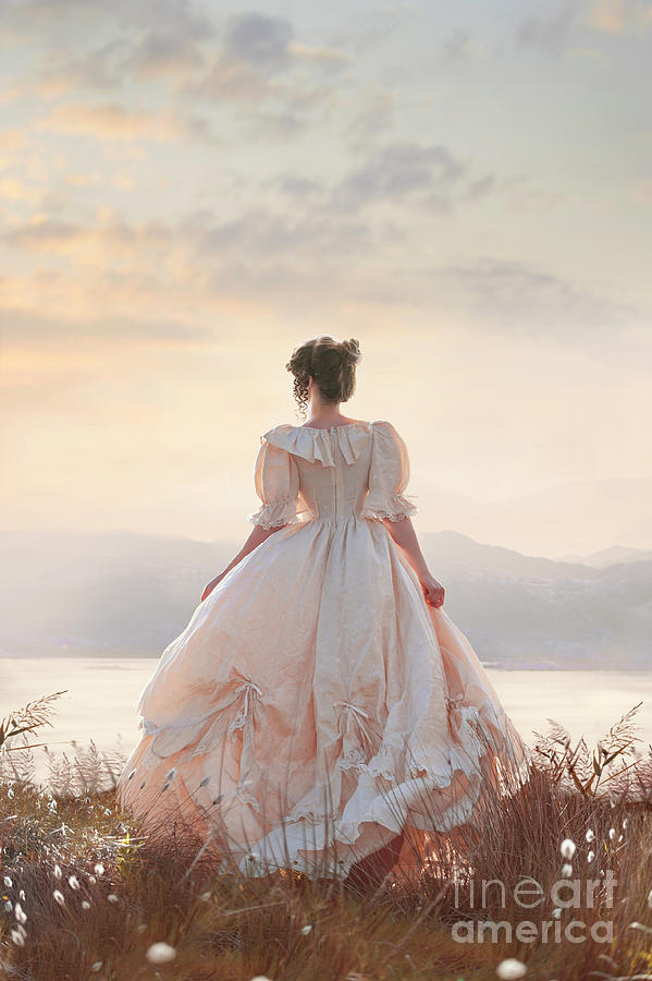 Victorian Woman At Sunset Overlooking A Lake Photograph by Lee Avison