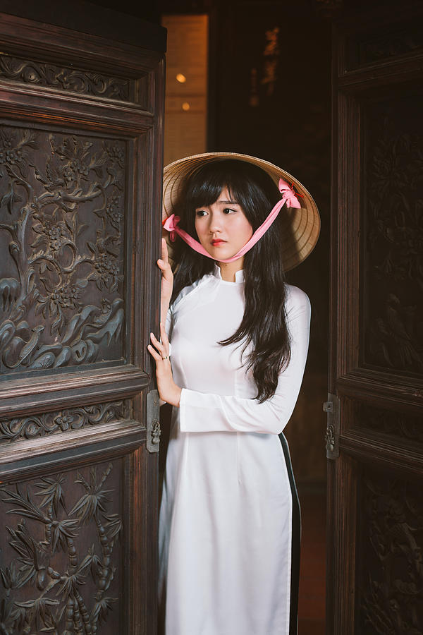 Vietnamese Girl with ao dai and non la. Photograph by Jethuynh